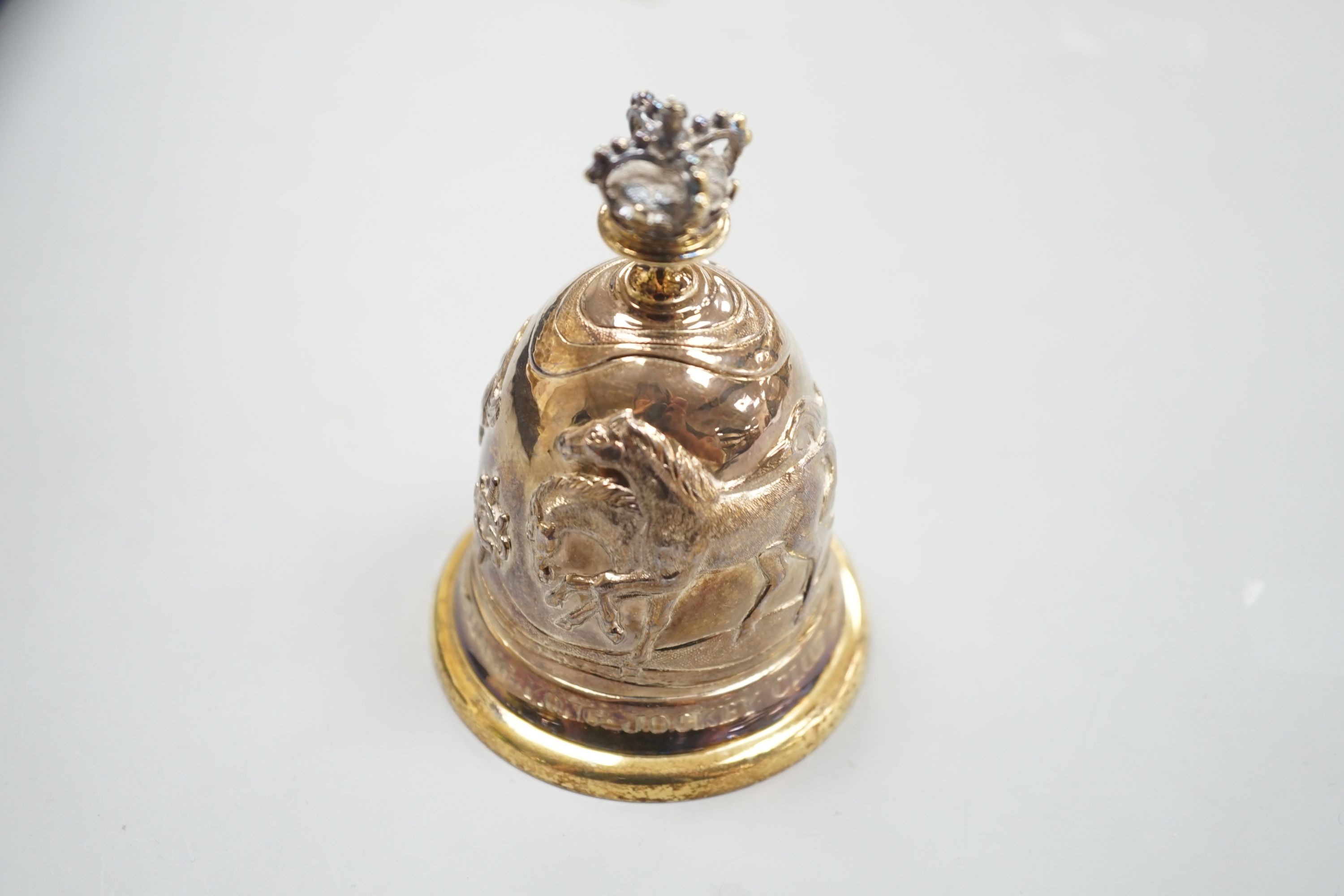 A cased modern embossed silver gilt hand bell, with engraved inscription, 'The Royal Hong Kong Jockey Club Centenary, 1884-1984', Garrard & Co, London, 1985, 94mm, 126 grams.